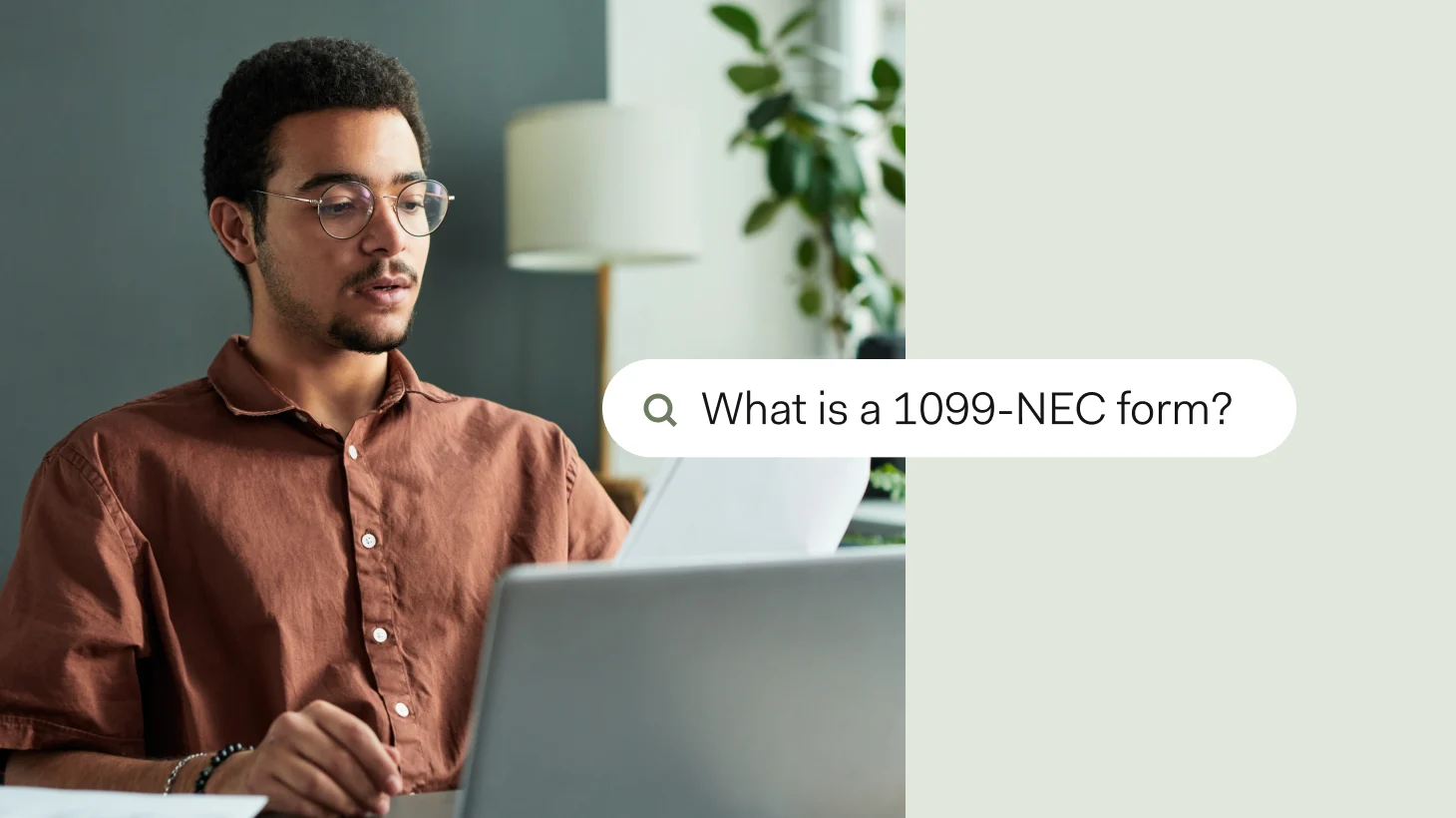 A man reviewing paperwork at his laptop, with a search bar overlay reading 'What is a 1099-NEC form?'