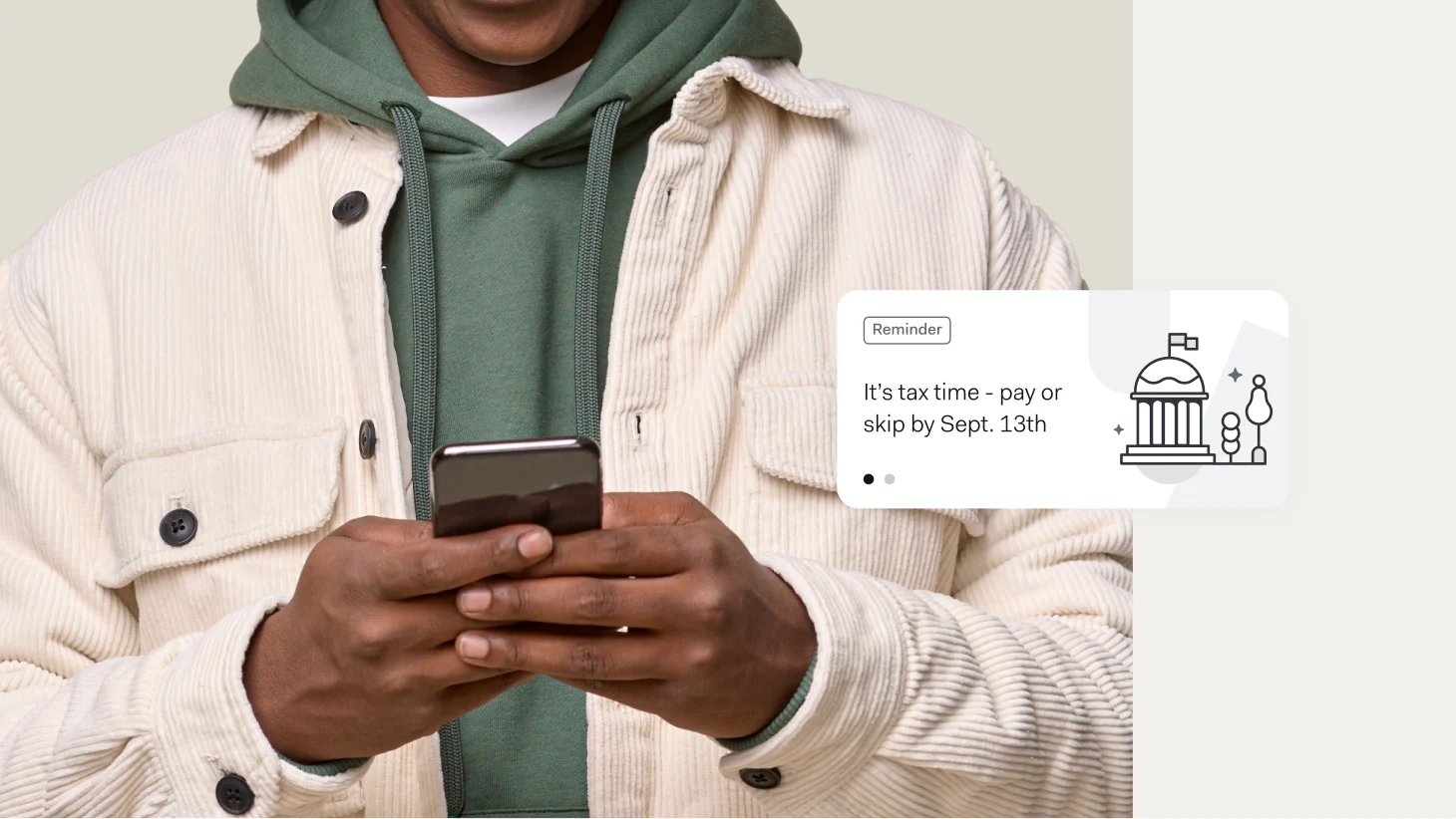 A person holding a phone beside a notification card reading 'Reminder: It's tax time - pay or skip by Sept. 13th,' next to a small courthouse icon