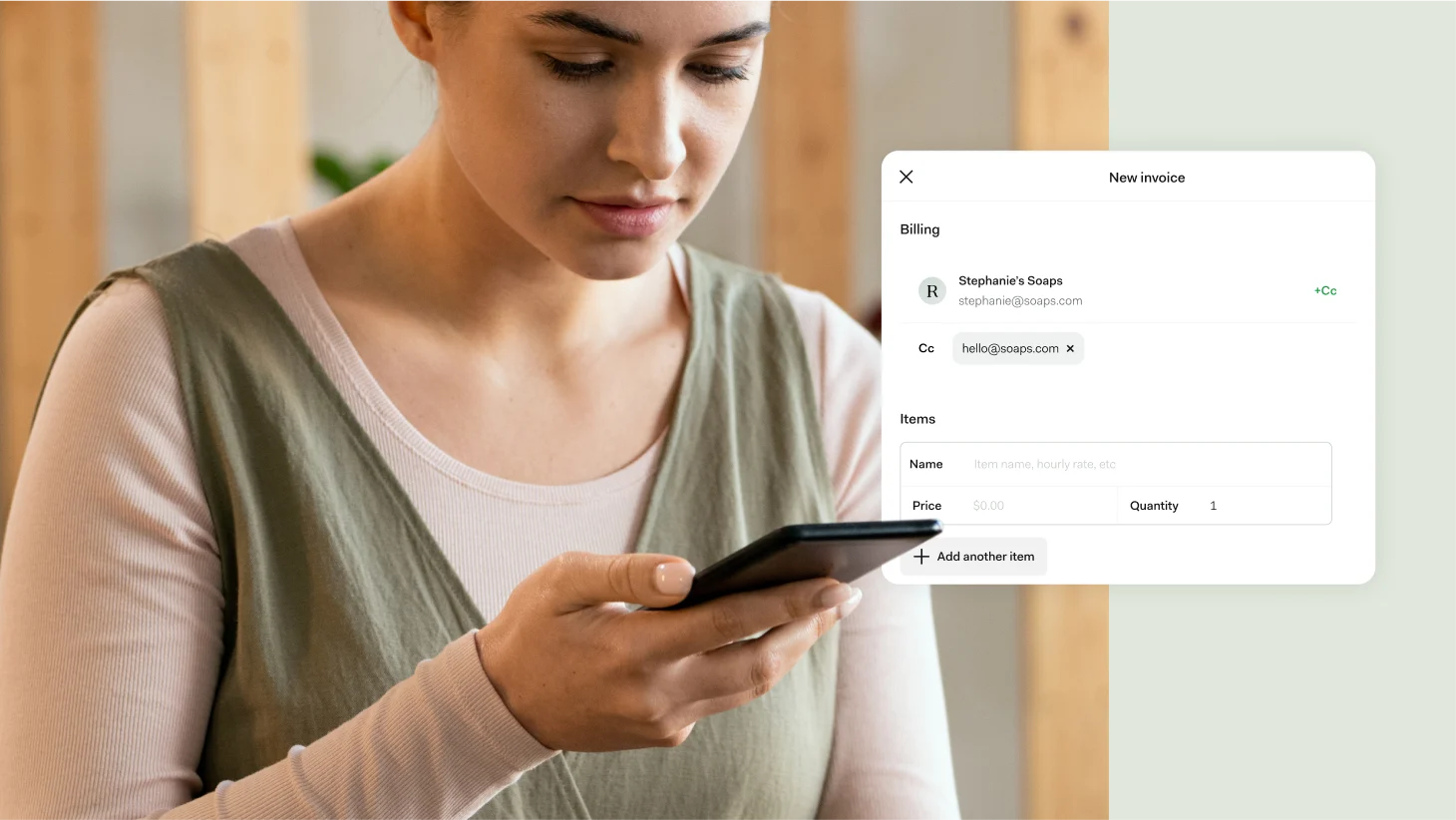 A woman checking her phone, beside a New invoice form billed to Stephanie's Soaps with item name, price, and quantity fields