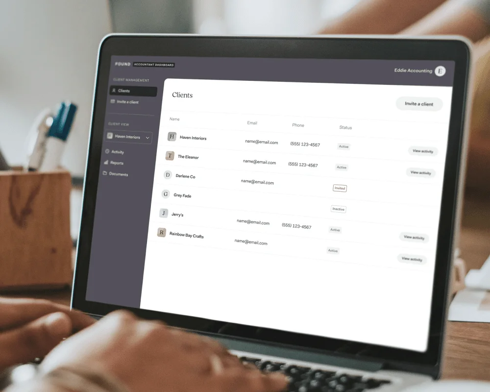 A laptop showing the Found accountant dashboard with a list of client businesses and their contact details