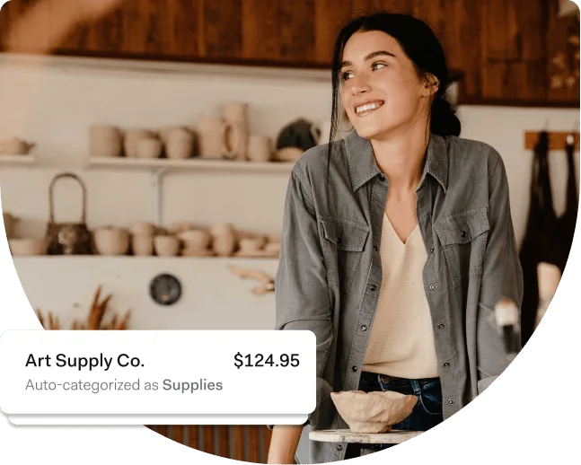 A ceramicist standing in a studio of unfired pots, beside a Found notification showing a $124.95 purchase at Art Supply Co. auto-categorized as Supplies.